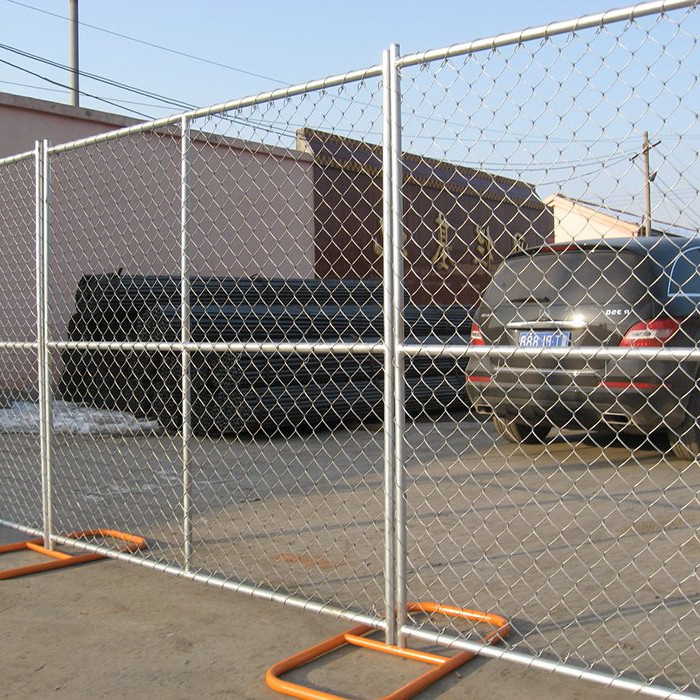 temporary chain link fence installed with orange oval stands