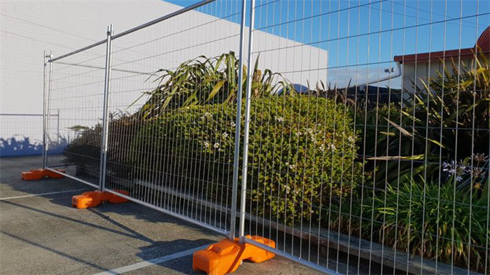 galvanized temporary fence installed with feet and clamps 